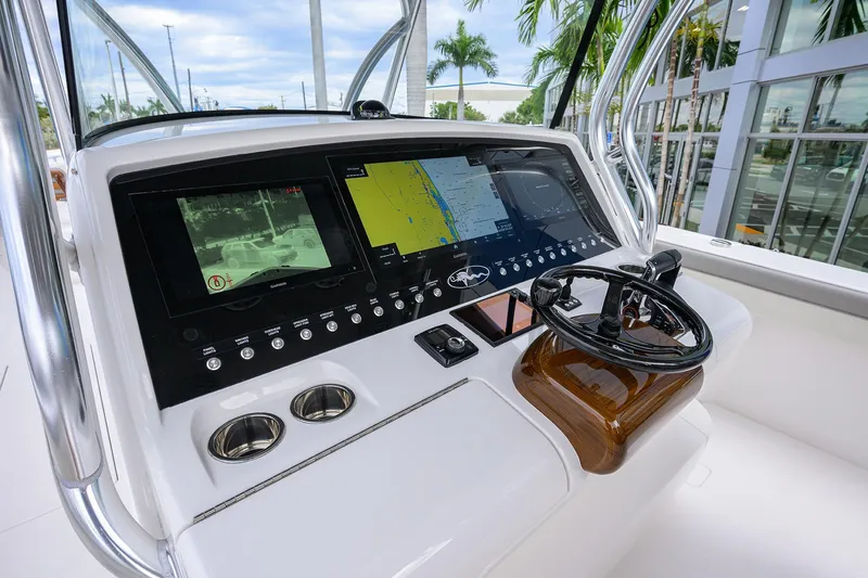 Slide: The Image of 2025 Valhalla Boatworks V-41 helm with advanced navigation displays and steering wheel. - 9