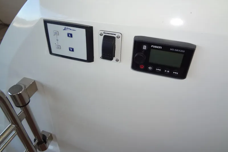 Slide: The Image of 2023 Prestige 420S yacht rear view under a metal roof. - 14