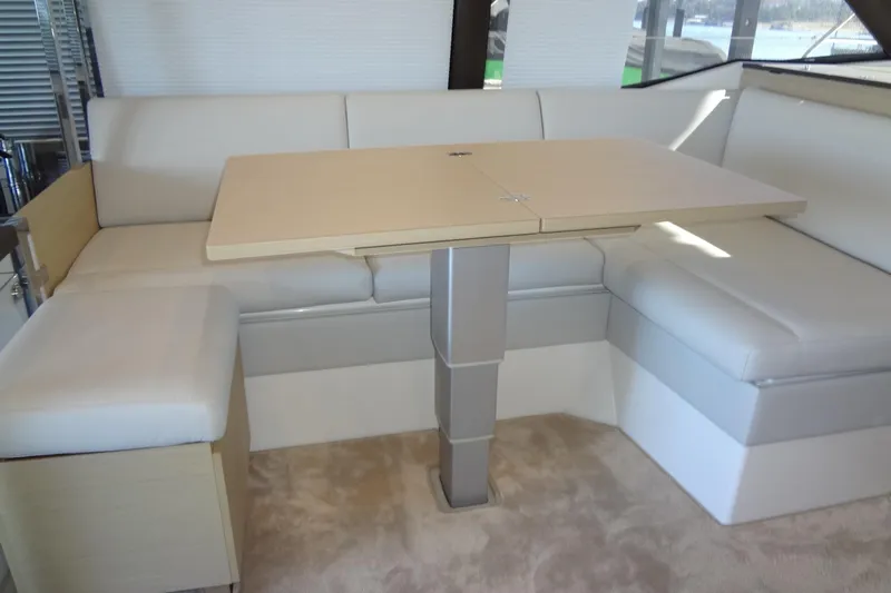 Slide: The Image of 2023 Prestige 420S yacht interior with control panel and compact fridge. - 33