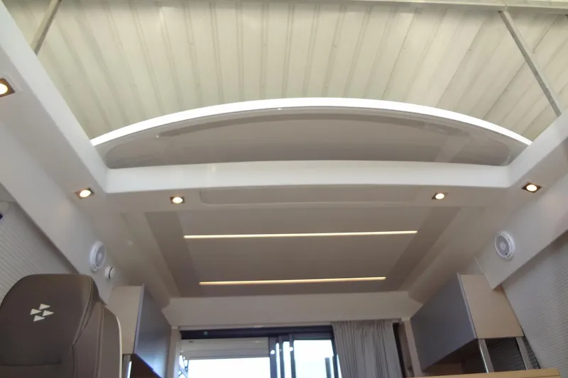 Slide: The Image of Organized cutlery set in a drawer, featuring spoons, forks, and knives. - 35