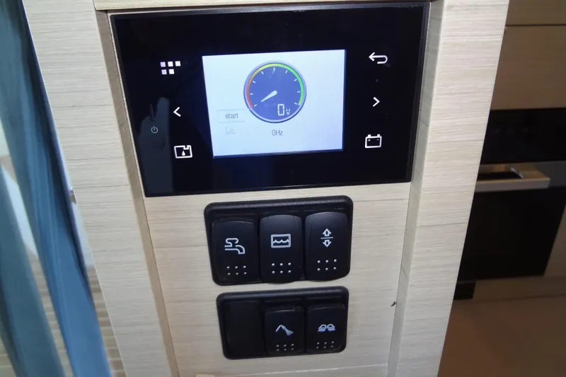 Slide: The Image of Control panel of 2023 Prestige 420S yacht with joystick and throttle levers. - 47