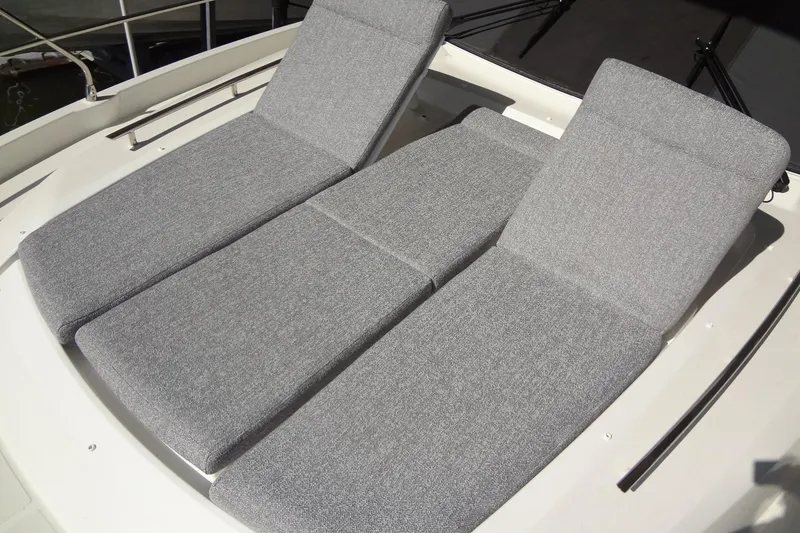 Slide: The Image of 2023 Prestige 420S yacht docked in a marina under a clear blue sky. - 5