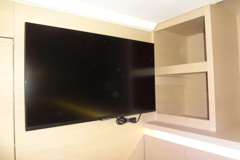 Slide: The Image of Interior view of 2023 Prestige 420S yacht, featuring stairs leading to a cozy cabin. - 54