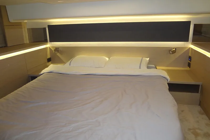 Slide: The Image of 2023 Prestige 420S interior with mounted TV and wooden shelving. - 59