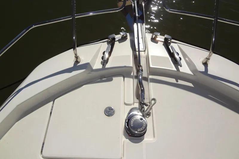 Slide: The Image of 2023 Prestige 420S yacht on water under a partly cloudy sky. - 6