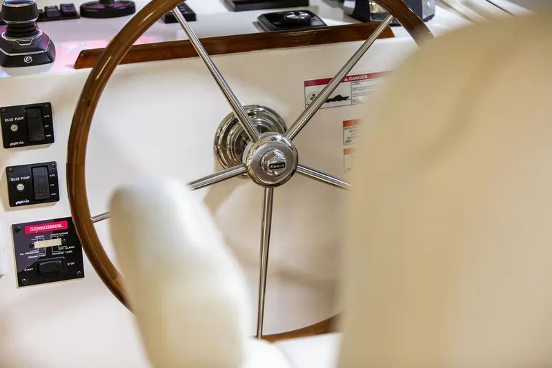 Slide: The Image of Steering wheel of 2018 MJM 35z boat with control panels and gauges. - 17