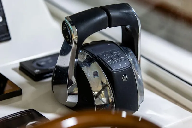 Slide: The Image of Throttle control of 2018 MJM 35z boat, featuring sleek design and modern controls. - 18
