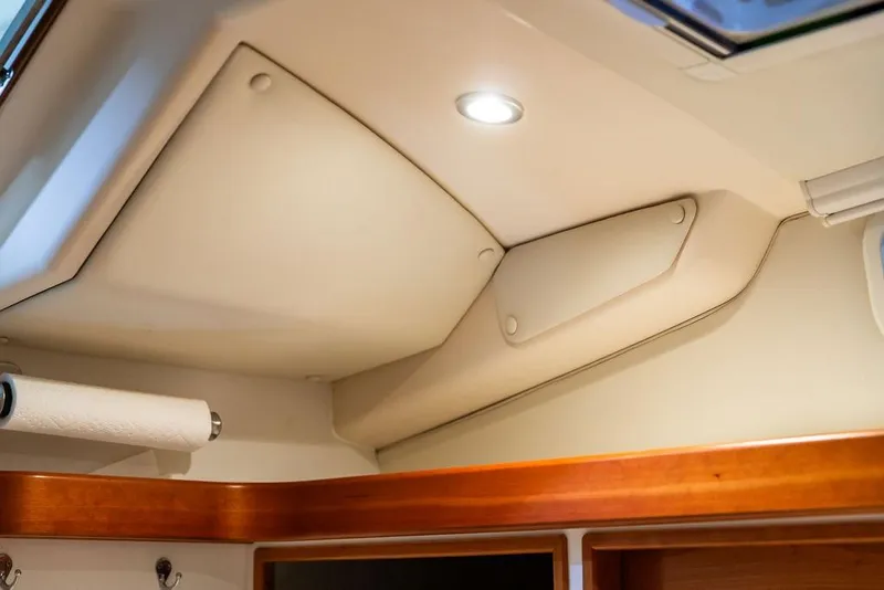 Slide: The Image of Interior ceiling of 2018 MJM 35z boat with recessed lighting and wood trim. - 25