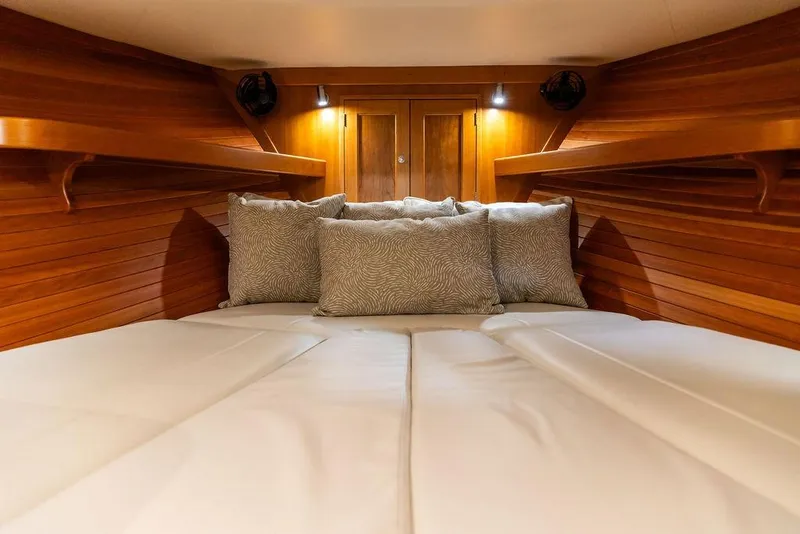 Slide: The Image of Luxurious cabin interior of 2018 MJM 35z yacht with cozy bedding and wooden finish. - 28