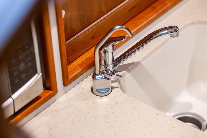 Slide: The Image of Modern kitchen sink and faucet in 2018 MJM 35z boat interior. - 29