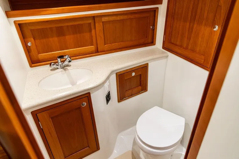 Slide: The Image of 2018 MJM 35z yacht bathroom with wooden cabinets and modern fixtures. - 30