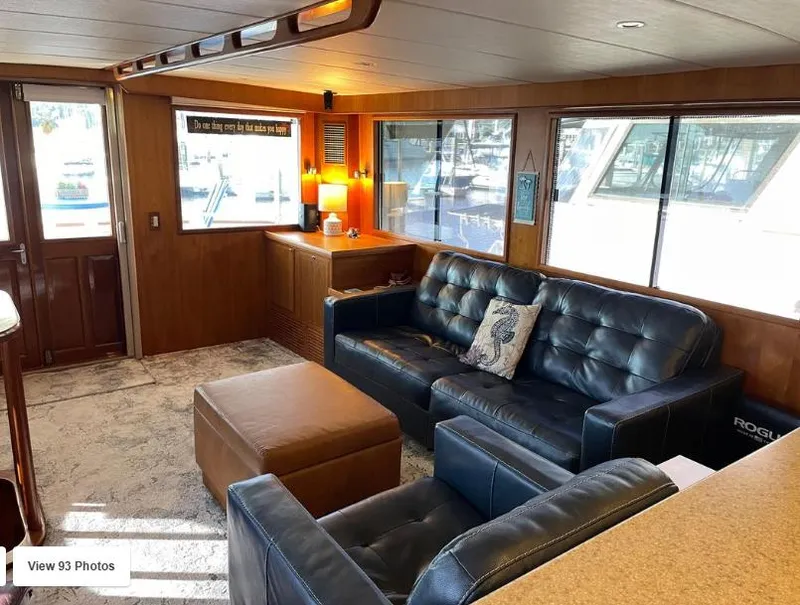 Slide: The Image of Luxurious interior of 2002 Grand Alaskan Cockpit Motor Yacht with leather seating and large windows. - 14