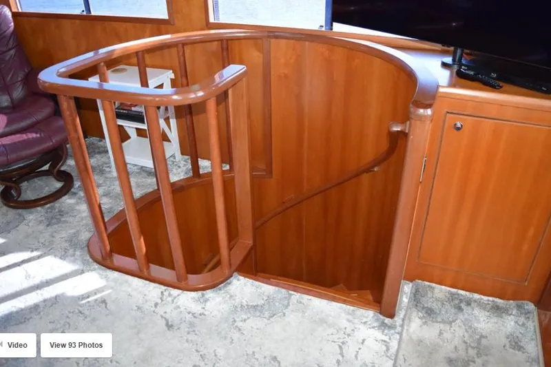Slide: The Image of Wooden staircase in 2002 Grand Alaskan Cockpit Motor Yacht interior. - 29