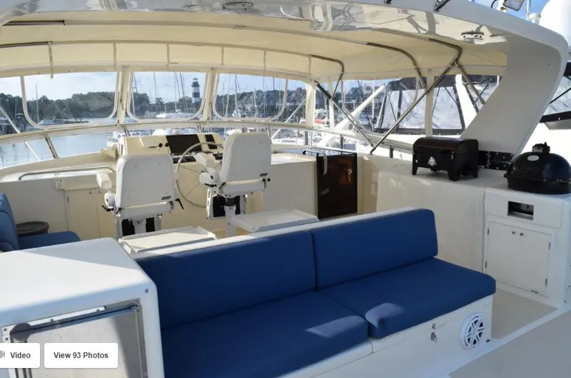 Slide: The Image of 2002 Grand Alaskan Cockpit Motor Yacht interior with blue seating and helm station. - 4