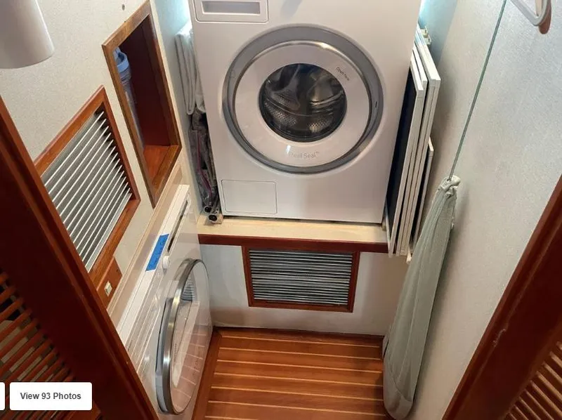 Slide: The Image of Laundry area in 2002 Grand Alaskan Cockpit Motor Yacht with washer and dryer. - 45