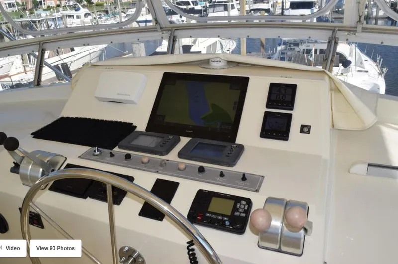 Slide: The Image of 2002 Grand Alaskan Cockpit Motor Yacht helm with navigation equipment and controls. - 8
