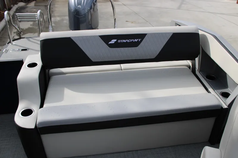 Slide: The Image of 2026 Starcraft VX 24 Q DH boat seat with cup holders, showcasing modern design. - 11