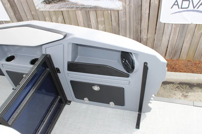 Slide: The Image of Interior of 2026 Starcraft VX 24 Q DH boat with storage compartments and cup holders. - 15