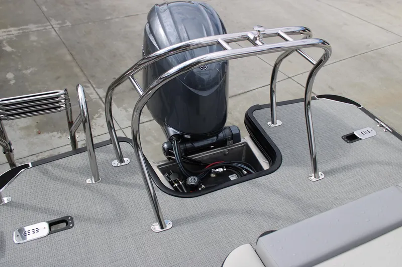Slide: The Image of 2026 Starcraft VX 24 Q DH boat with outboard motor and stainless steel railings. - 16