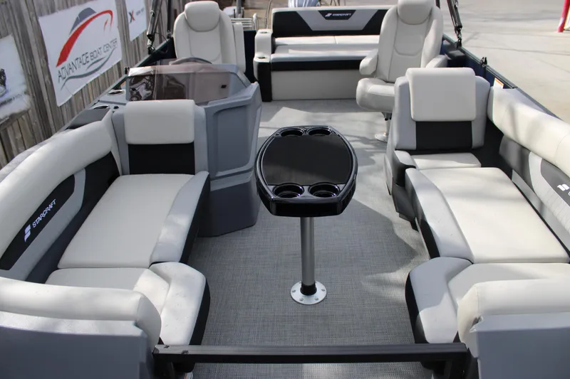 Slide: The Image of 2026 Starcraft VX 24 Q DH boat interior with spacious seating and central table. - 4