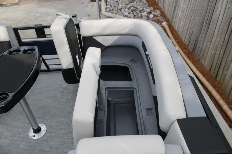 Slide: The Image of 2026 Starcraft VX 24 Q DH boat interior with seating and storage compartment. - 5