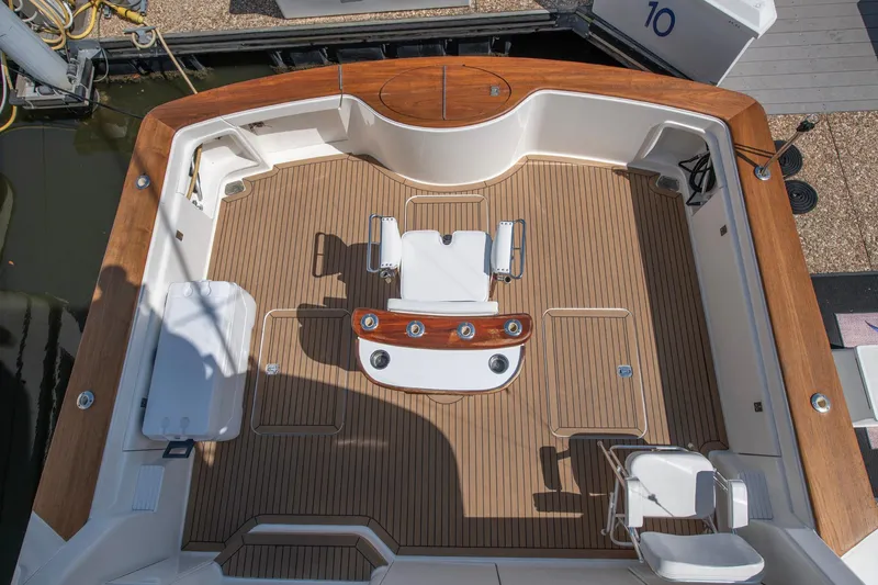 Slide: The Image of 2003 Ocean Yachts 62 Super Sport EB cockpit with teak flooring and fishing chair. - 10