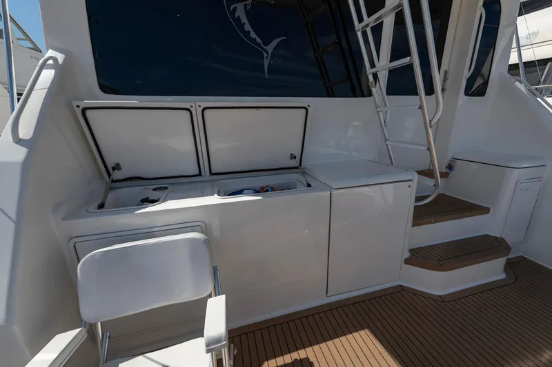 Slide: The Image of 2003 Ocean Yachts 62 Super Sport EB deck with seating and storage compartments. - 11