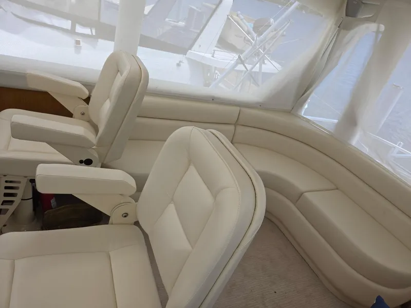 Slide: The Image of Luxurious interior seating of 2003 Ocean Yachts 62 Super Sport EB with white upholstery. - 20