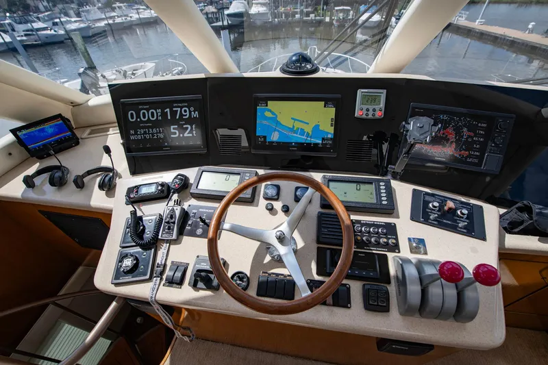 Slide: The Image of Control panel of a 2003 Ocean Yachts 62 Super Sport EB with navigation equipment. - 27