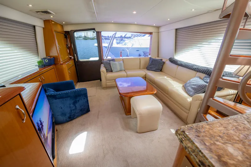 Slide: The Image of Luxurious interior of 2003 Ocean Yachts 62 Super Sport EB with plush seating and elegant decor. - 31
