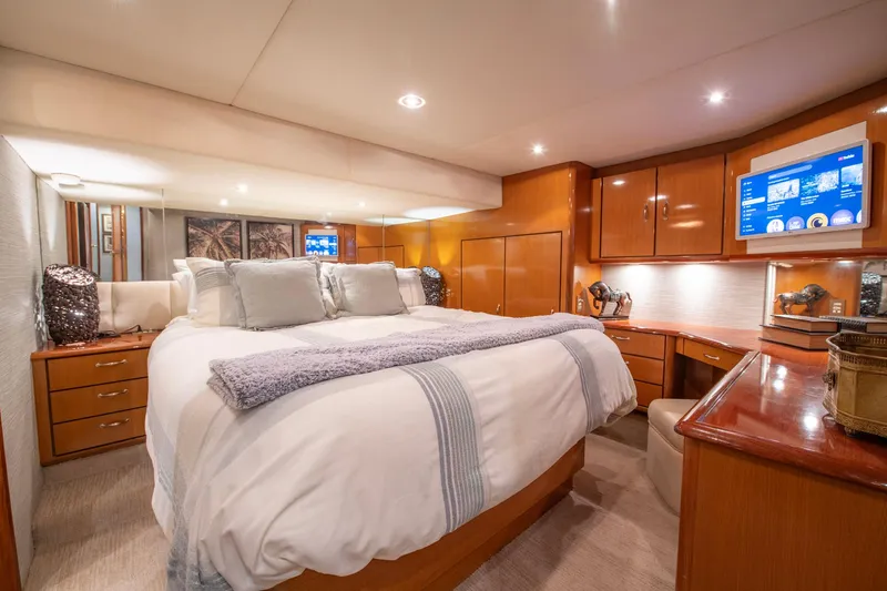 Slide: The Image of Luxurious bedroom interior of 2003 Ocean Yachts 62 Super Sport EB with elegant wood finishes. - 37