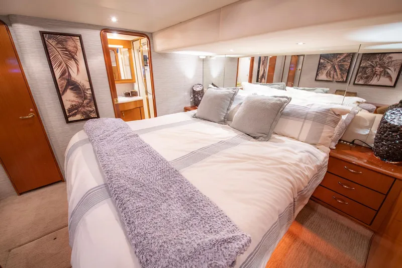 Slide: The Image of Luxurious bedroom interior of 2003 Ocean Yachts 62 Super Sport EB with cozy bedding. - 40