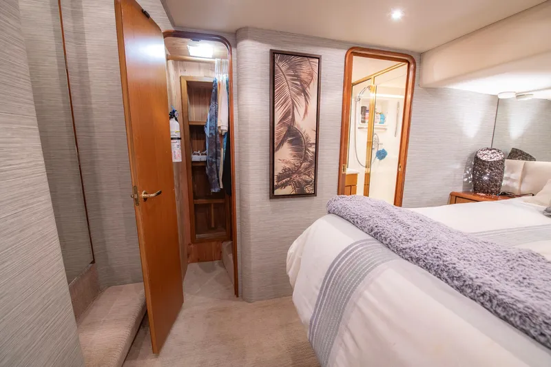 Slide: The Image of Luxurious bedroom interior of 2003 Ocean Yachts 62 Super Sport EB with elegant decor. - 41