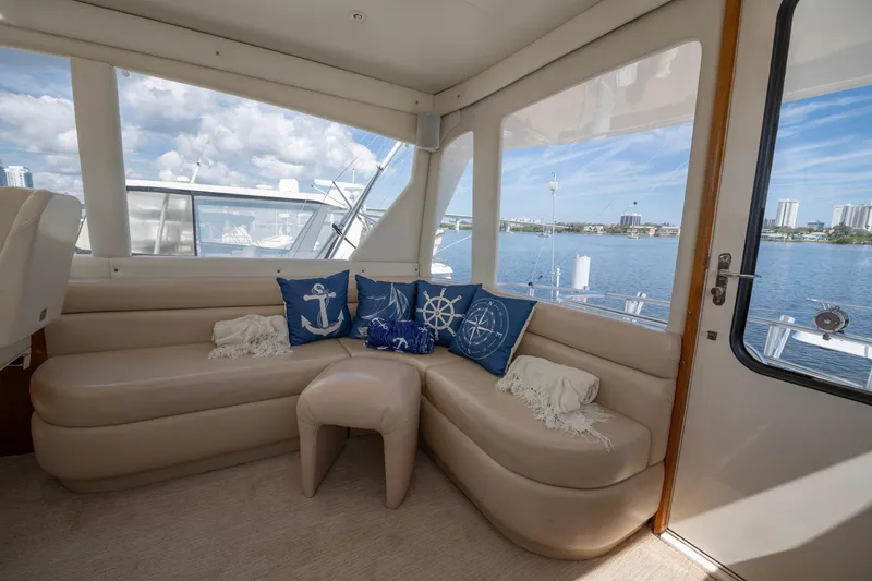 Slide: The Image of Luxurious interior of 2003 Ocean Yachts 62 Super Sport EB with nautical-themed cushions. - 16