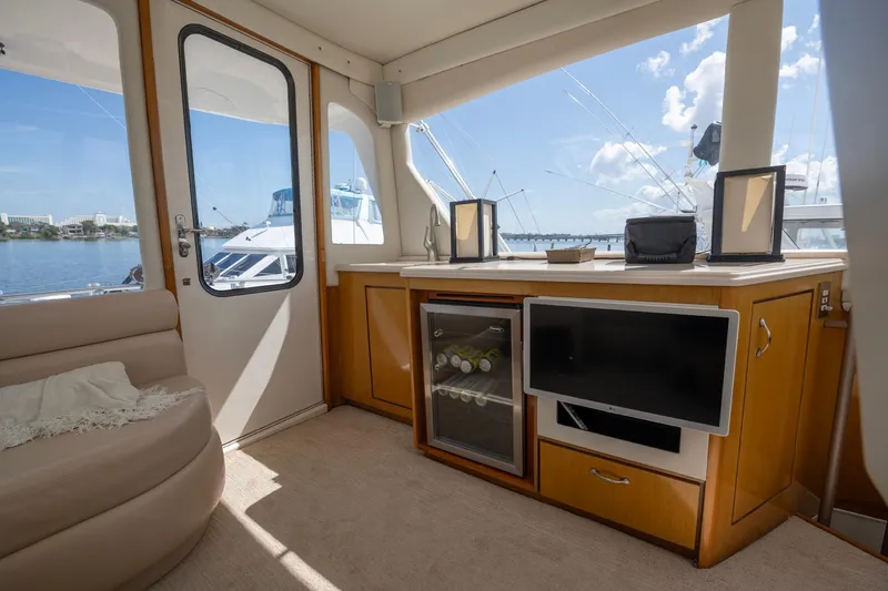 Slide: The Image of Luxurious interior of 2003 Ocean Yachts 62 Super Sport EB with scenic marina view. - 17