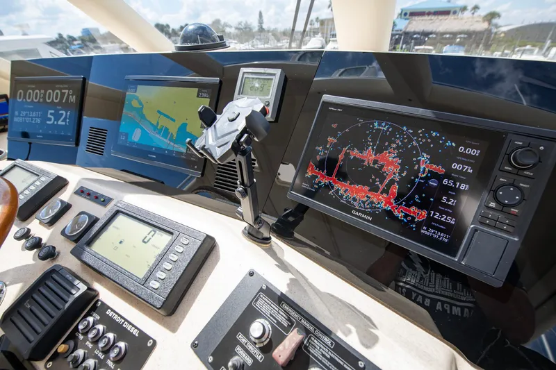 Slide: The Image of Control panel of 2003 Ocean Yachts 62 Super Sport EB with navigation screens and instruments. - 26
