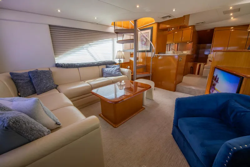 Slide: The Image of Luxurious interior of 2003 Ocean Yachts 62 Super Sport EB with elegant seating and modern decor. - 30