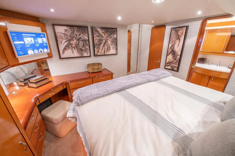 Slide: The Image of Luxurious bedroom in 2003 Ocean Yachts 62 Super Sport EB with elegant decor and modern amenities. - 42