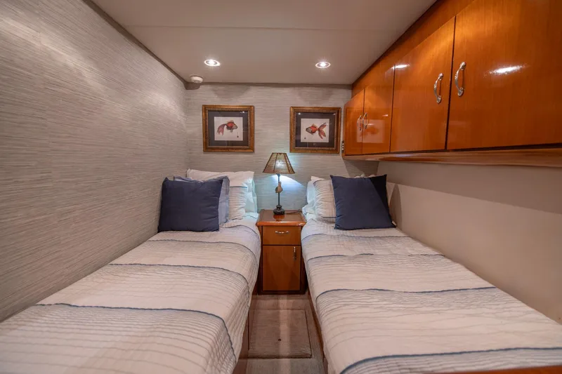 Slide: The Image of Twin cabin with wooden cabinets in 2003 Ocean Yachts 62 Super Sport EB. - 49