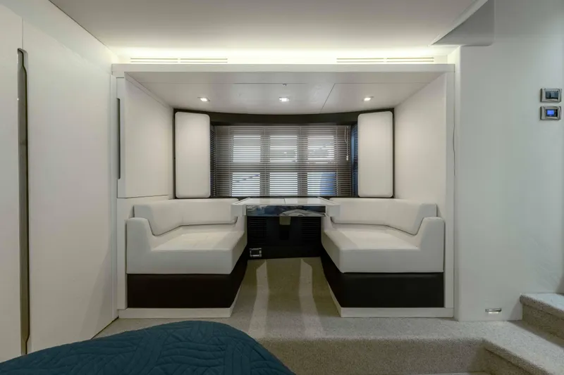 Slide: The Image of Interior of 2015 Azimut 55S yacht with modern white seating and sleek design. - 11