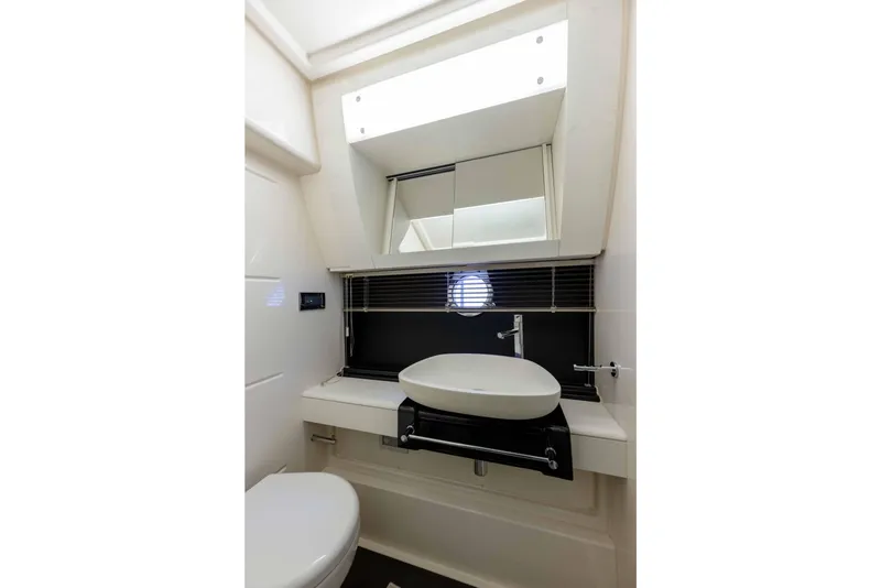 Slide: The Image of Luxurious bathroom in 2015 Azimut 55S yacht with modern sink and mirror. - 25