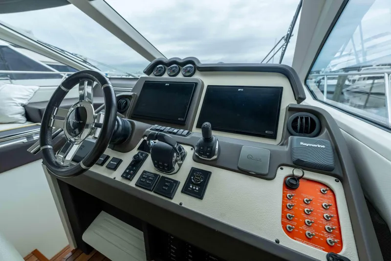 Slide: The Image of Cockpit of 2015 Azimut 55S yacht with modern navigation controls and steering wheel. - 36