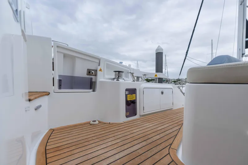 Slide: The Image of 2015 Azimut 55S yacht deck with teak flooring and sleek design elements. - 43