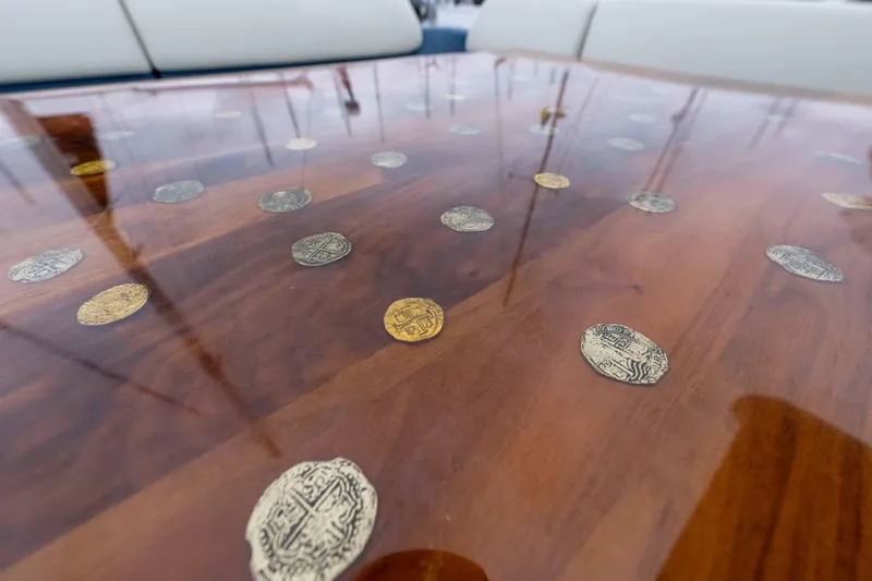 Slide: The Image of Luxurious Azimut 55S 2015 yacht table with embedded decorative coins. - 59