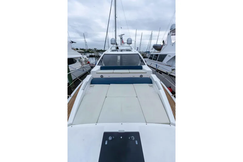 Slide: The Image of 2015 Azimut 55S yacht with spacious deck, docked at marina. - 66