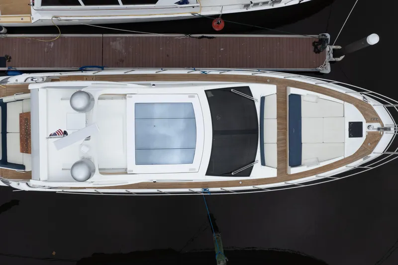 Slide: The Image of Overhead view of a 2015 Azimut 55S yacht docked at a marina. - 68