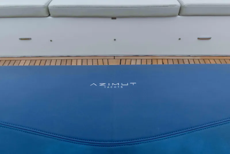 Slide: The Image of 2015 Azimut 55S yacht deck with branded blue cushion. - 76