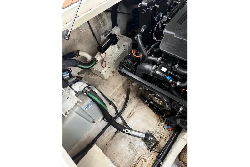 Slide: The Image of Engine compartment of a 2007 Sea Ray 280 Cuddy Cabin boat, showing mechanical components. - 16