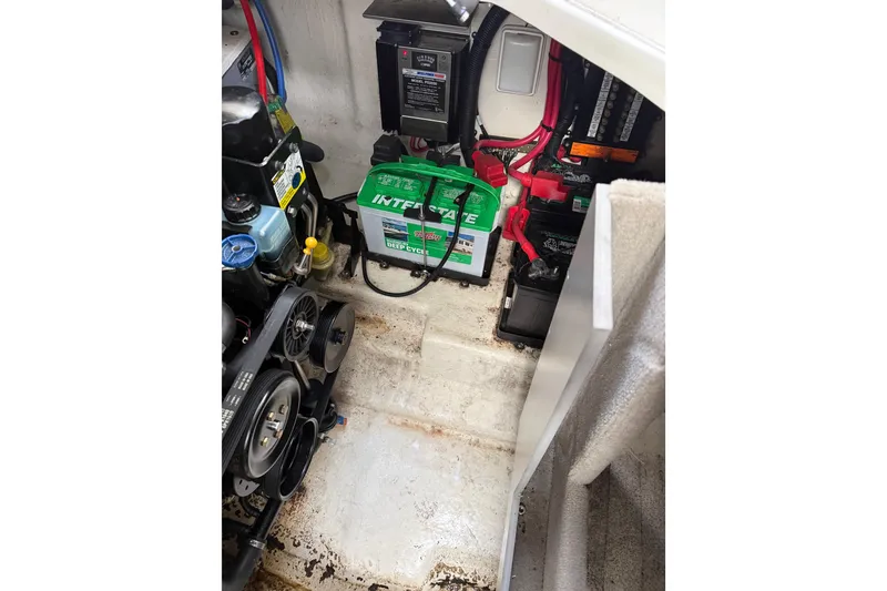 Slide: The Image of Engine compartment of 2007 Sea Ray 280 Cuddy Cabin with batteries and mechanical components. - 17