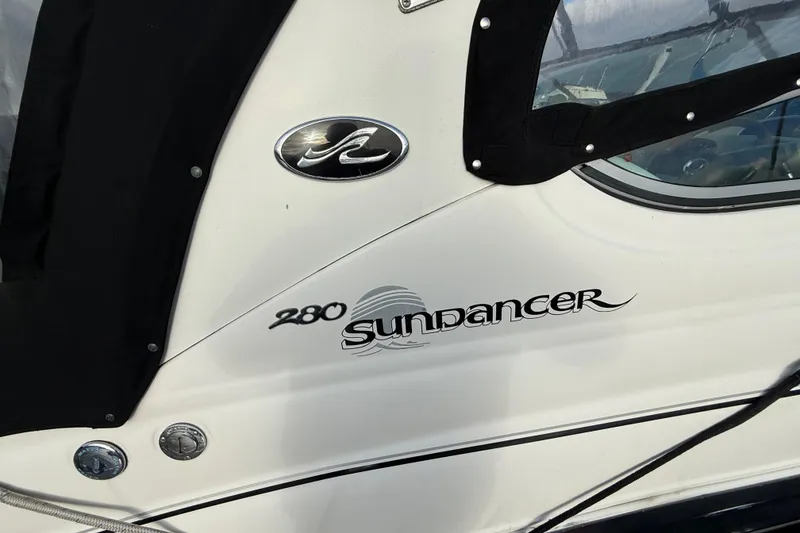 Slide: The Image of 2007 Sea Ray 280 Cuddy Cabin boat with Sundancer logo and black canopy. - 3